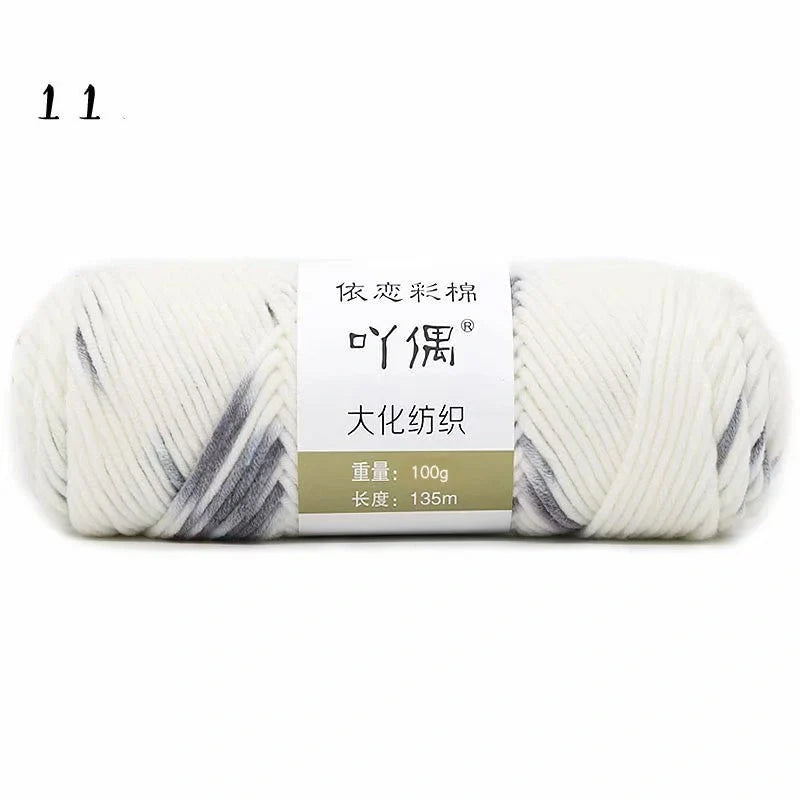 Luxurious gradient milk cotton yarn balls in a variety of vibrant colours, perfect for knitting, weaving, and other textile crafts.