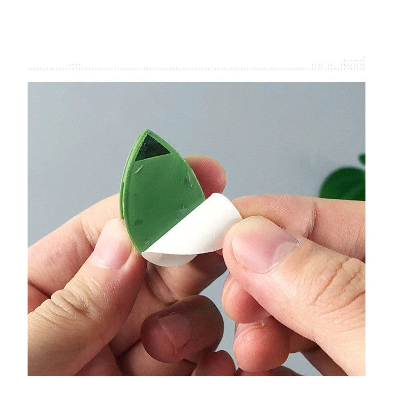 Versatile leaf-shaped plant clips in green, designed to provide discreet and effective support for climbing vines and potted plants