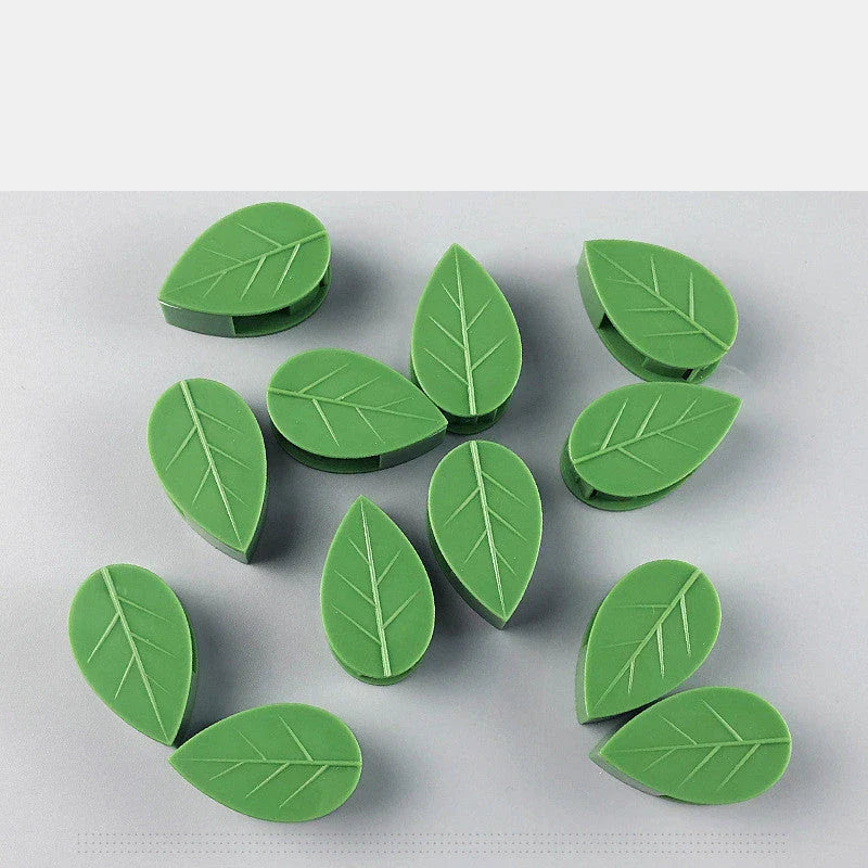 Versatile leaf-shaped plant clips in green, designed to provide discreet and effective support for climbing vines and potted plants