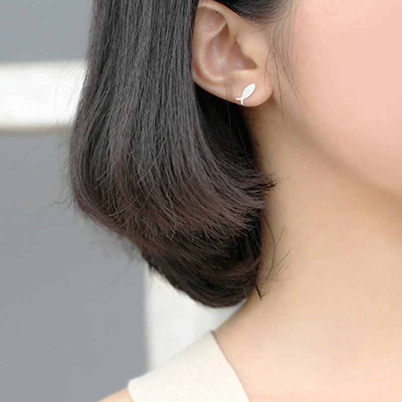 Elegant asymmetric 925 sterling silver stud earrings with cat and fish motifs, a modern and sophisticated accessory