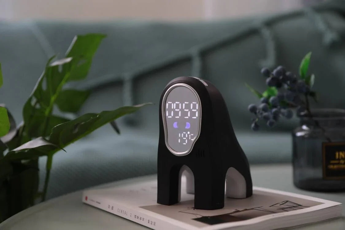 Stylish alarm clock with LED display, ambient lighting, and snooze function for a relaxing sleep environment