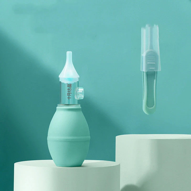 Infant silicone nasal aspirator pump in pink and green, designed for gentle cold relief