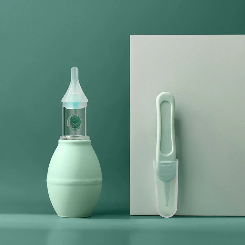 Infant silicone nasal aspirator pump in pink and green, designed for gentle cold relief