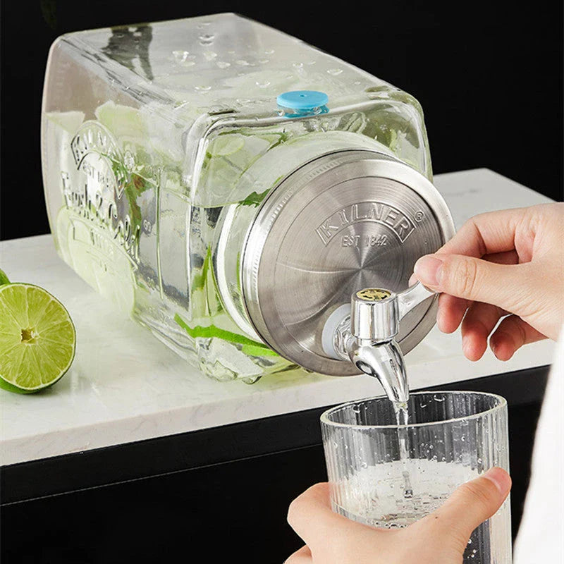 A stylish glass beverage dispenser with a sleek faucet, perfect for serving chilled drinks at home or events.
