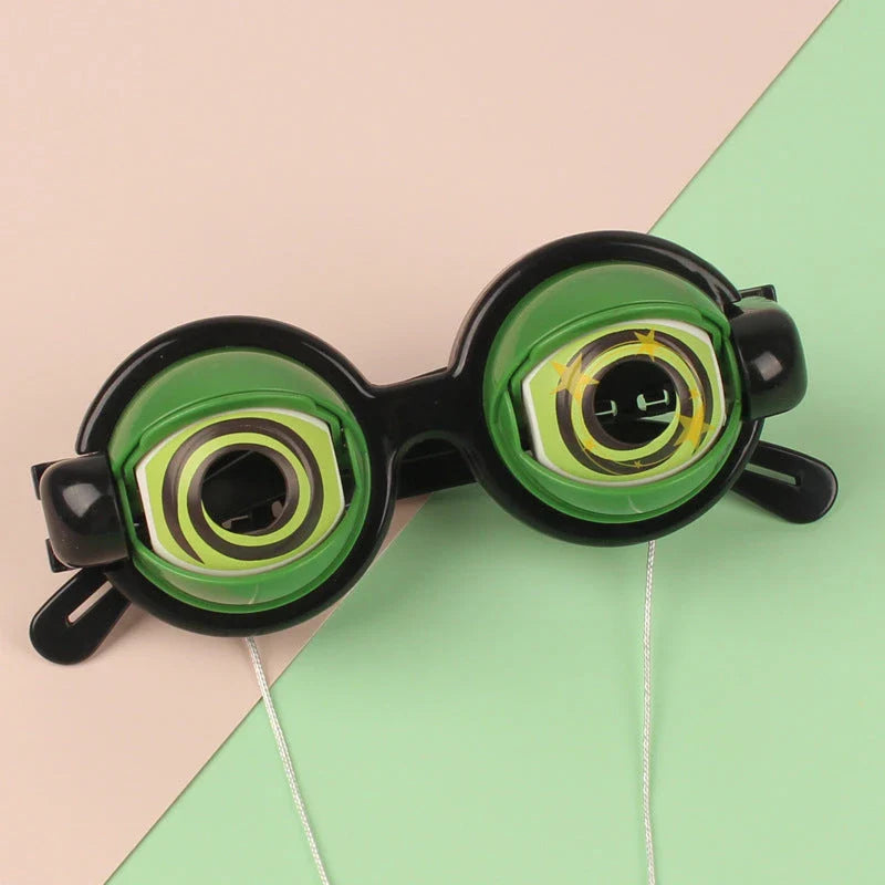 Quirky eyewear accessories in various colours, including yellow, pink, black, and black-green. Designed for kids' parties to encourage imagination and play.