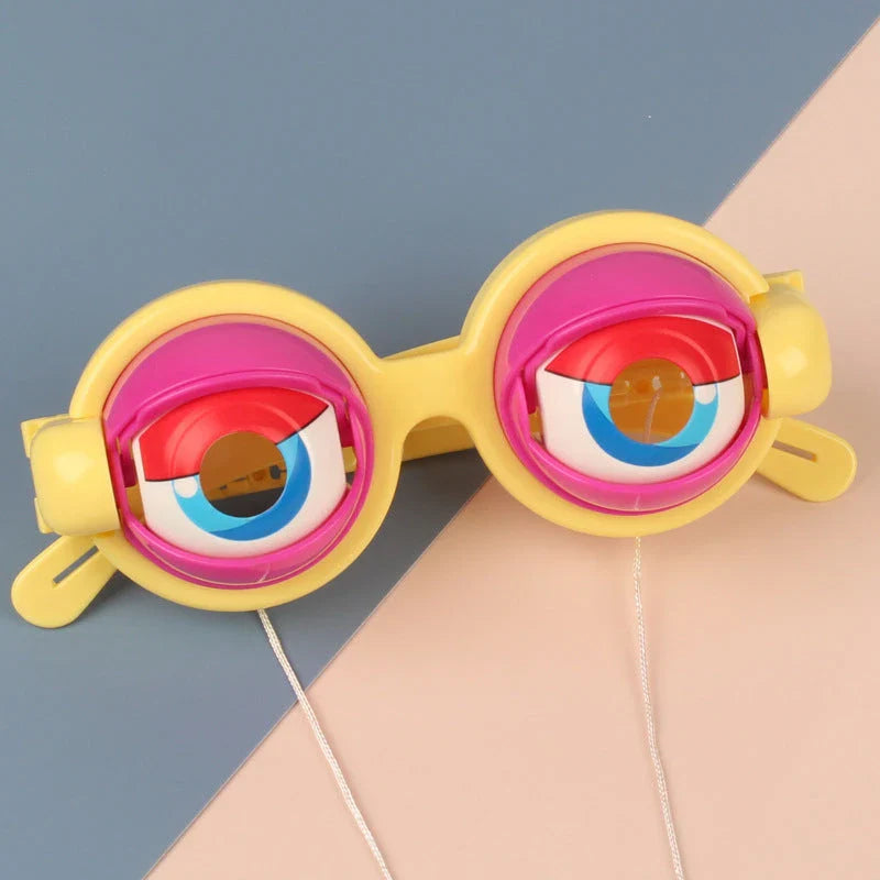 Quirky eyewear accessories in various colours, including yellow, pink, black, and black-green. Designed for kids' parties to encourage imagination and play.