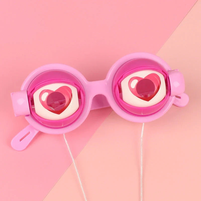Quirky eyewear accessories in various colours, including yellow, pink, black, and black-green. Designed for kids' parties to encourage imagination and play.