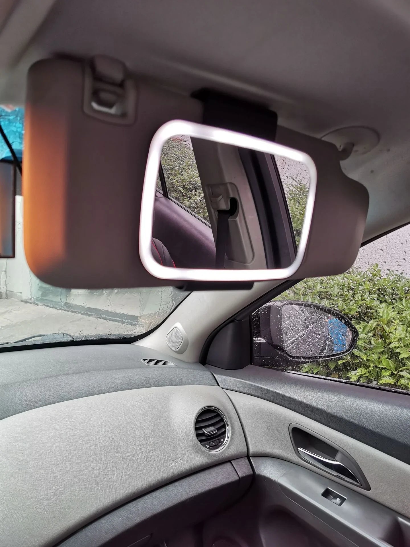 Premium in-car makeup mirror with 21 LED lights for flawless application, adjustable brightness, and discreet sun visor mount