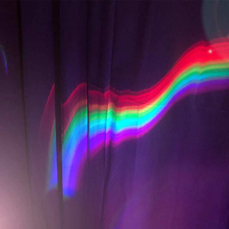 Enchanting rainbow projection lamp with vibrant multi-coloured LED lighting, creating a calming, relaxing atmosphere in the bedroom