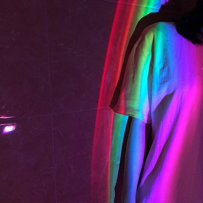 Enchanting rainbow projection lamp with vibrant multi-coloured LED lighting, creating a calming, relaxing atmosphere in the bedroom