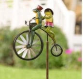 Charming wrought iron garden ornament with whimsical animal motif, adjustable retractable pole, and weather-resistant construction