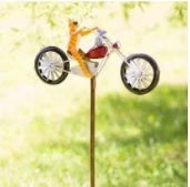 Charming wrought iron garden ornament with whimsical animal motif, adjustable retractable pole, and weather-resistant construction