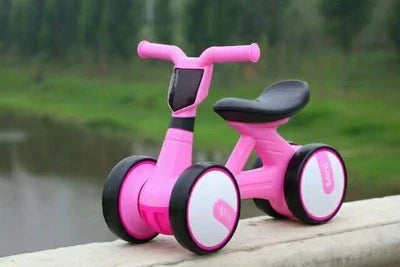 Sturdy three-wheeled balance bike for British toddlers with durable steel frame, comfortable PU leather seat, and smooth-rolling EVA foam tyres