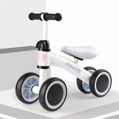 Sturdy three-wheeled balance bike for British toddlers with durable steel frame, comfortable PU leather seat, and smooth-rolling EVA foam tyres