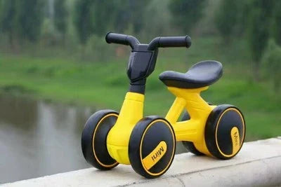 Sturdy three-wheeled balance bike for British toddlers with durable steel frame, comfortable PU leather seat, and smooth-rolling EVA foam tyres