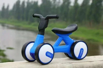 Sturdy three-wheeled balance bike for British toddlers with durable steel frame, comfortable PU leather seat, and smooth-rolling EVA foam tyres