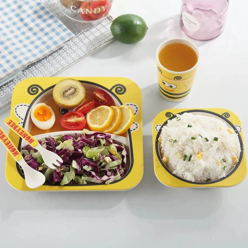 Five-piece bamboo fibre children's tableware set with plates, bowls, cups, spoons, and forks in various animal-themed designs