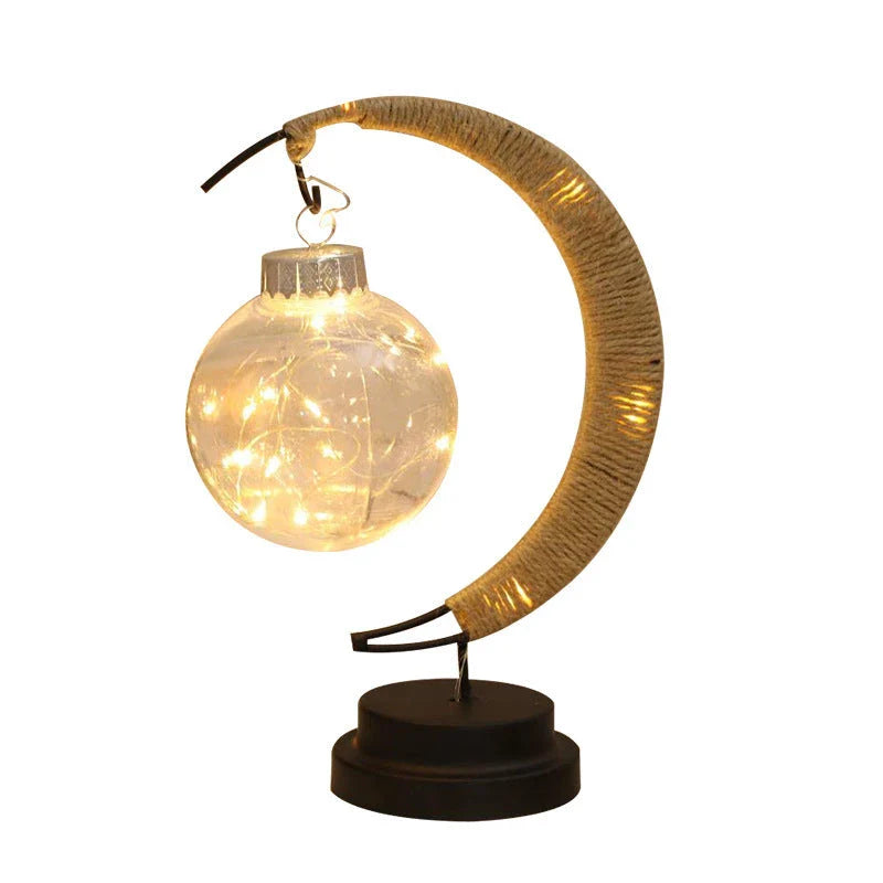 Lunar LED Lamp with crescent-shaped holder, emitting warm, soothing light in a variety of colour options