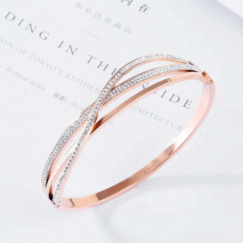 Titanium steel bracelet with geometric diamond detailing, available in rose gold, golden, and silver finishes