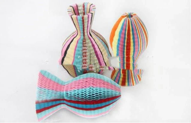 A versatile transforming paper sun hat that can be used for various holiday celebrations and outings