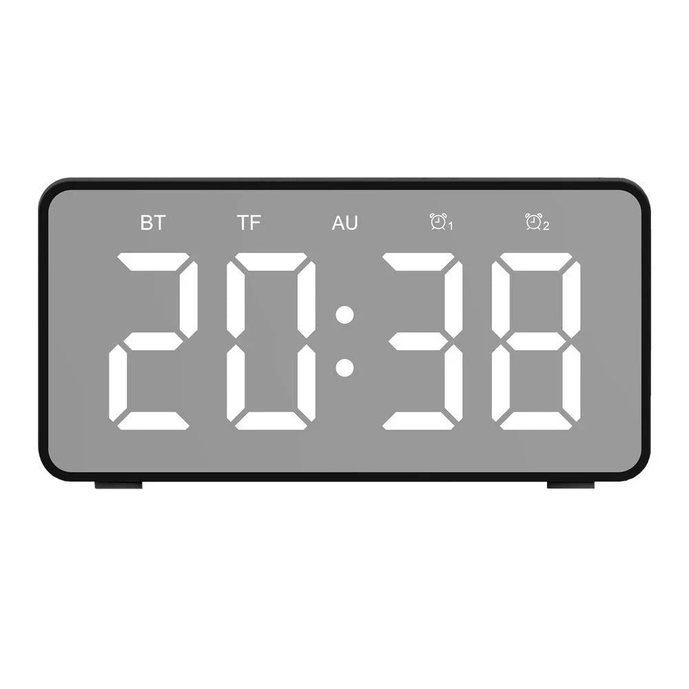 Versatile wireless charging Bluetooth speaker alarm clock with LED display, compact and sleek design.
