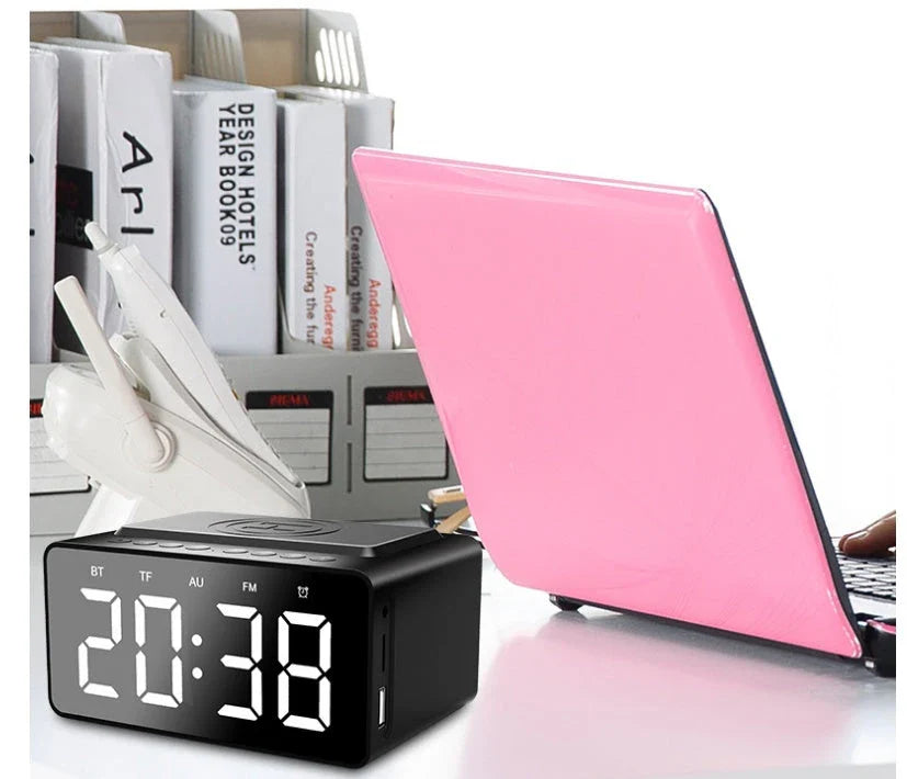 Versatile wireless charging Bluetooth speaker alarm clock with LED display, compact and sleek design.