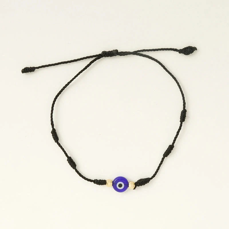 Braided evil eye bracelet set with 7-knot design for luck and protection, adjustable for all wrist sizes.