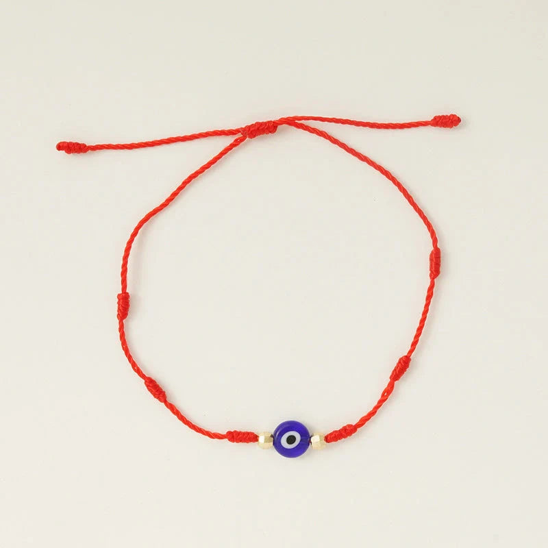 Braided evil eye bracelet set with 7-knot design for luck and protection, adjustable for all wrist sizes.