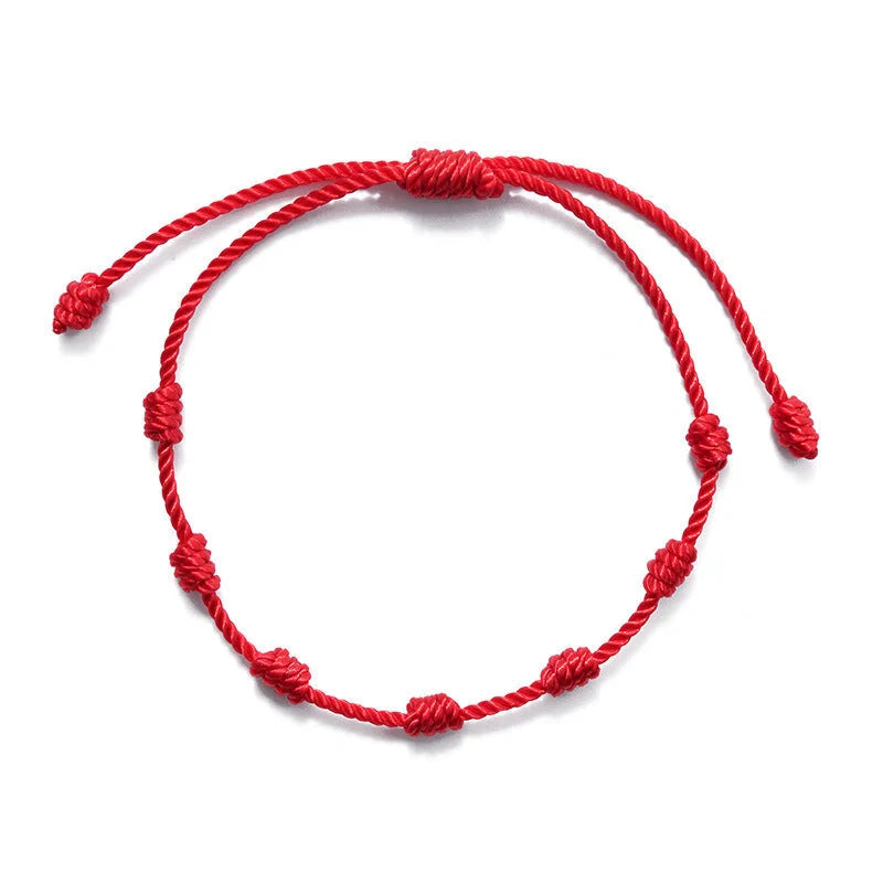 Braided evil eye bracelet set with 7-knot design for luck and protection, adjustable for all wrist sizes.