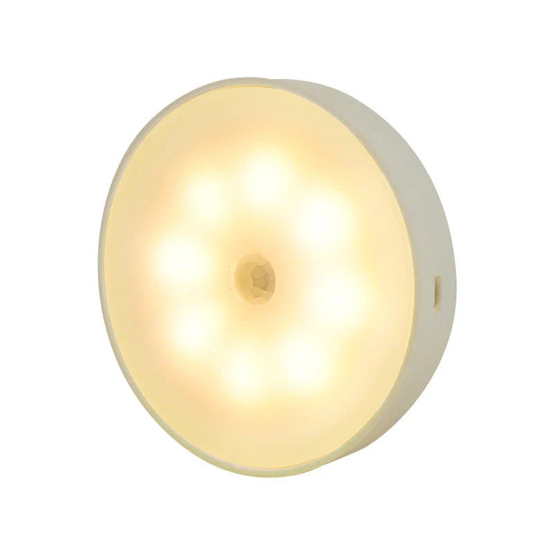 Motion-activated LED puck lights in warm and white color options, with various pack sizes and USB recharging