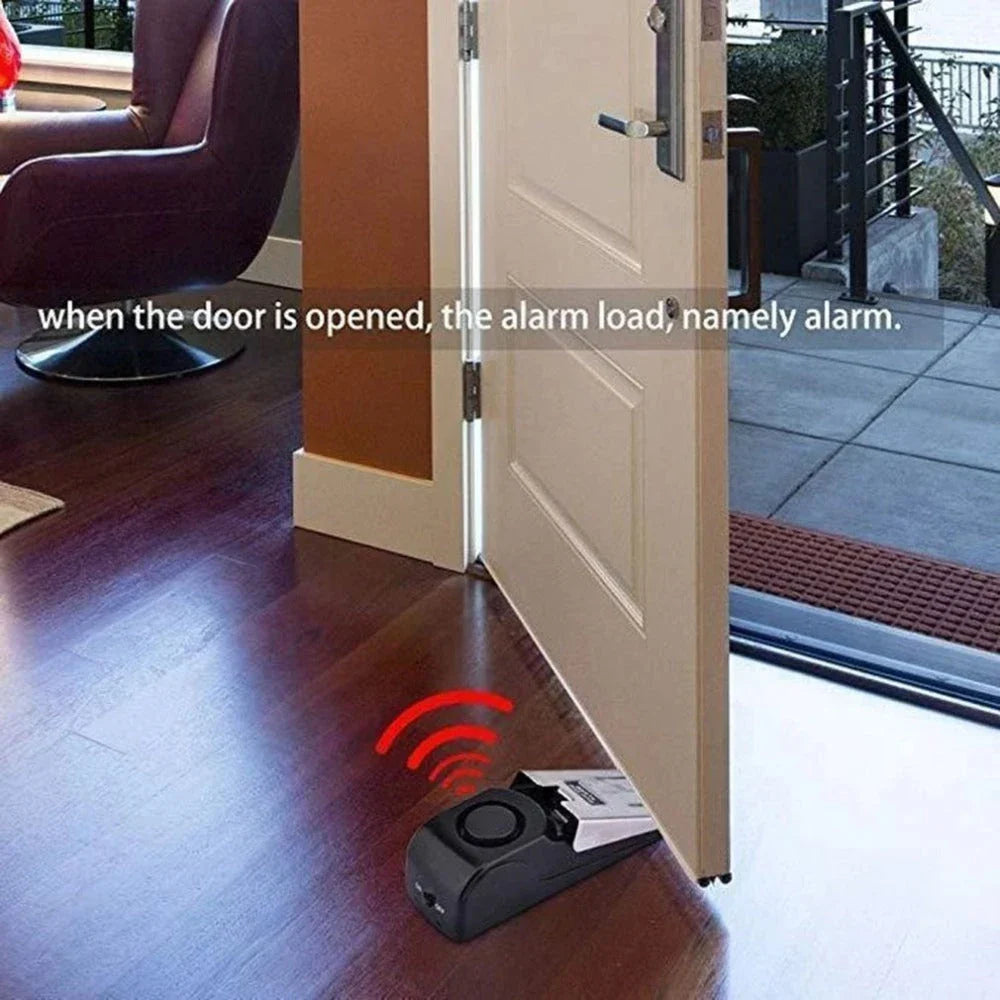 Wedge-shaped home security alarm with ABS construction and loud siren to deter intruders
