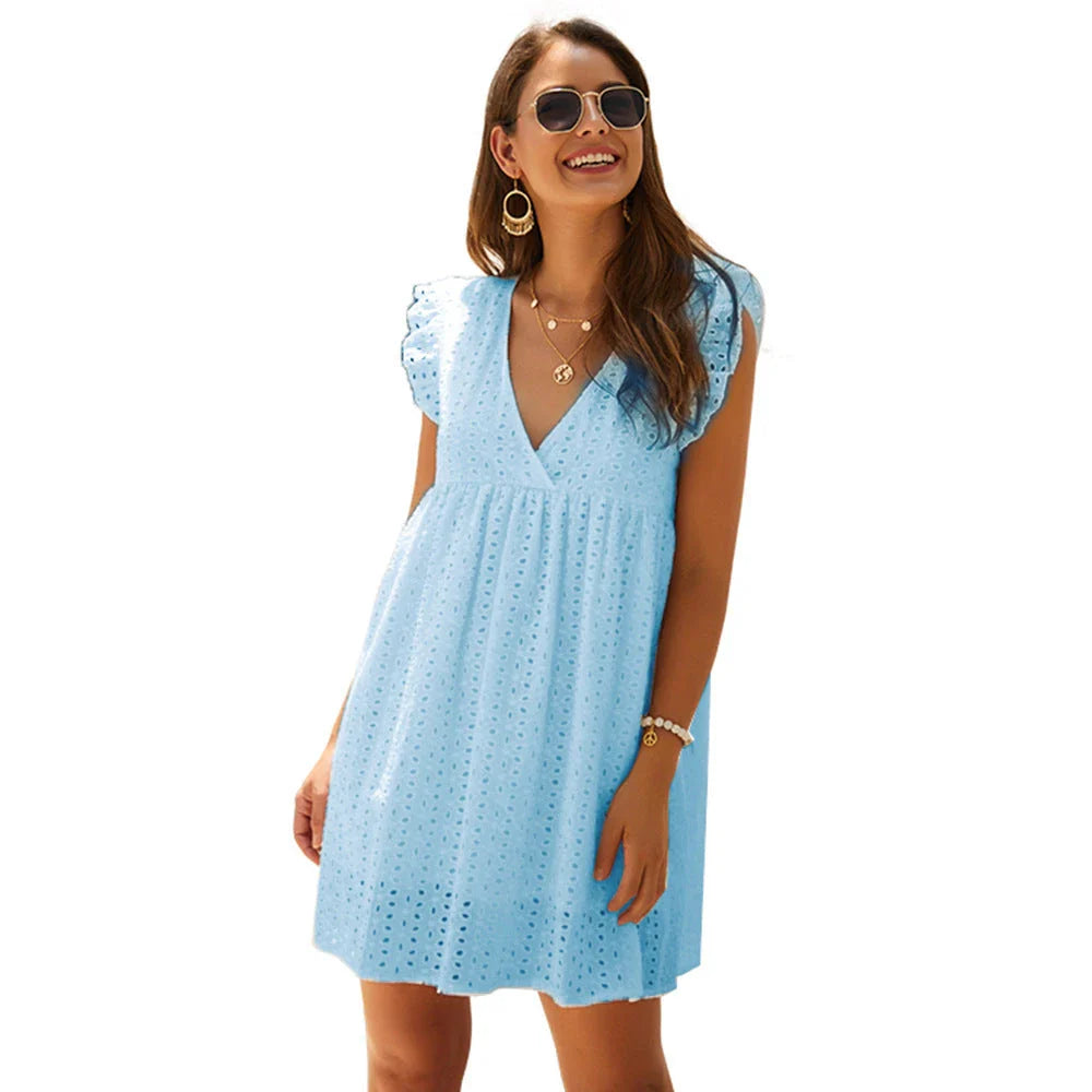 A stylish cotton mini dress with a v-neck and ruffled sleeves, perfect for summer days and nights.