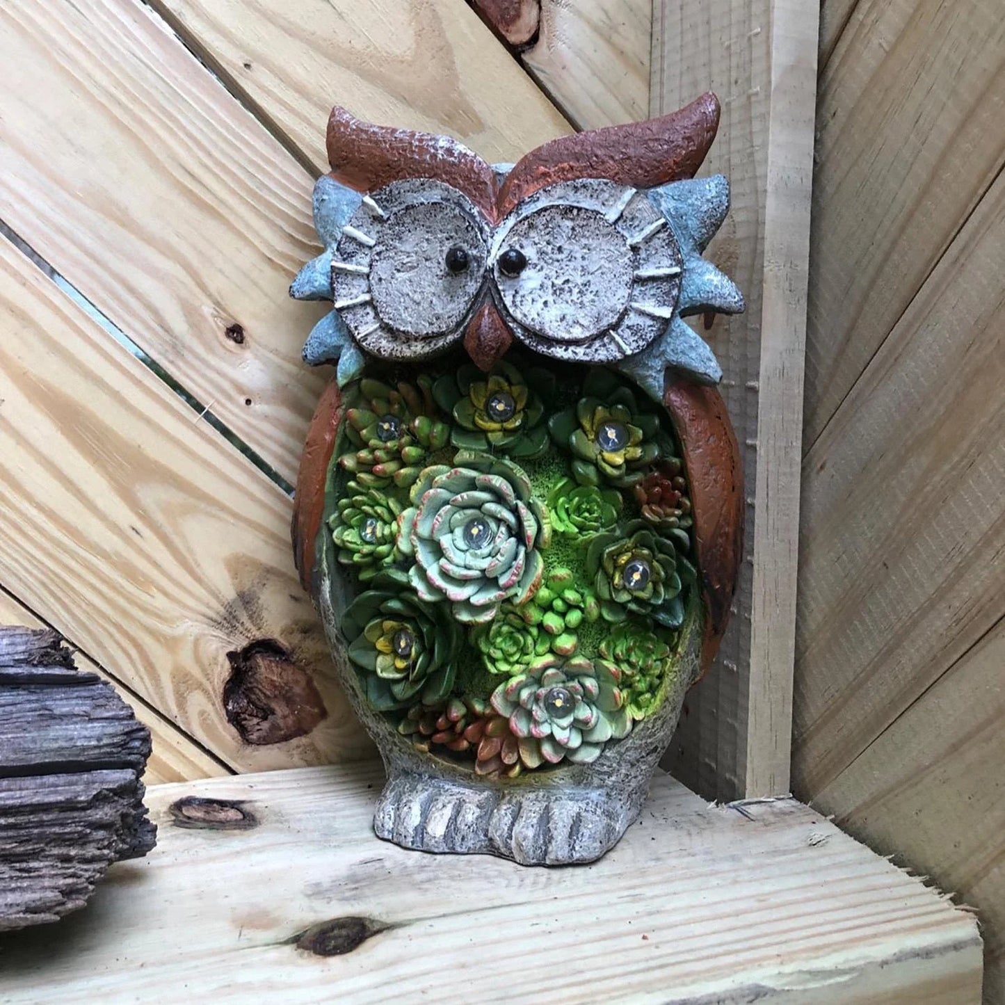 A charming solar-powered outdoor owl light made of high-quality resin, providing warm illumination for your yard or garden