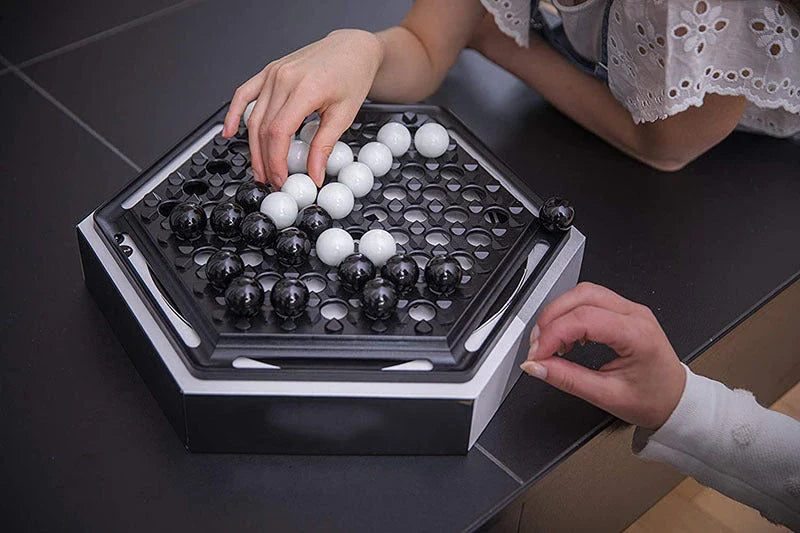 Abalone strategy game with marble board and pieces for family and kids to play