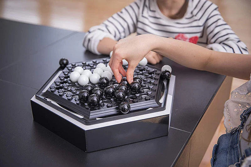 Abalone strategy game with marble board and pieces for family and kids to play