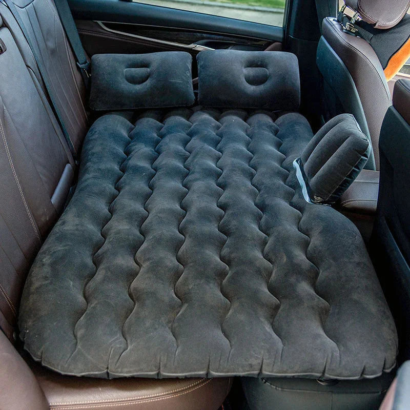Inflatable car mattress with pillows in various colors, perfect for comfortable road trips and outdoor adventures
