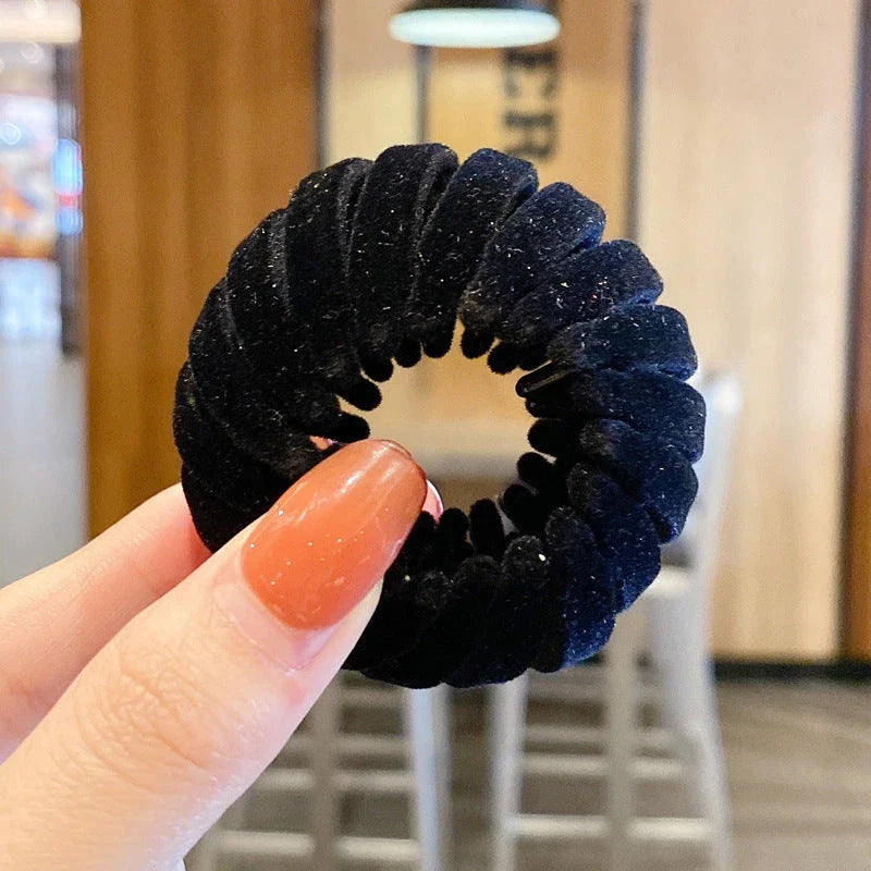 Elegant hair circle accessory with flexible design and teeth for creating stylish ponytails