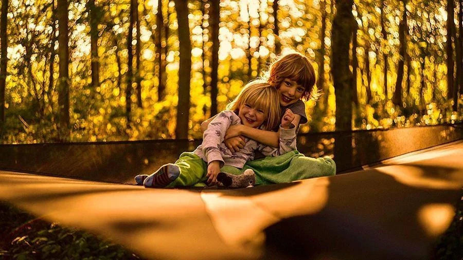 Spacious 3-person outdoor hammock with unique 3-point anchor system for maximum comfort and stability