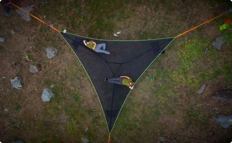 Spacious 3-person outdoor hammock with unique 3-point anchor system for maximum comfort and stability