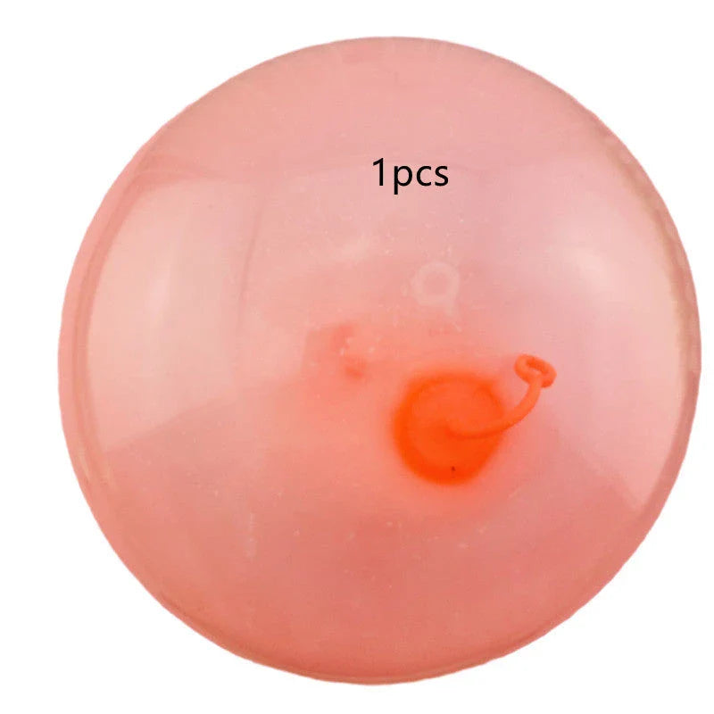 Oversized inflatable bounce balls in various vibrant colors for fun parties and celebrations