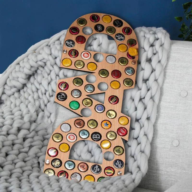 Stylish wooden beer bottle cap display organiser with customizable wooden letters and storage spaces for collecting caps