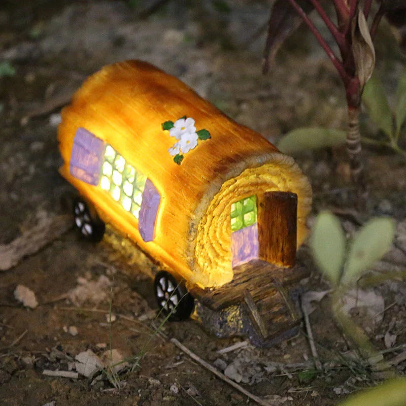 Solar-powered fairy house lamp with warm, inviting glow for outdoor garden decor