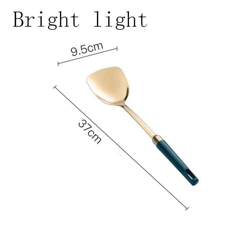 Elegant stainless steel kitchenware set with mirror-polished finish and gold-plated accents, including various utensils like shovels, spoons, ladles, and a serving frame