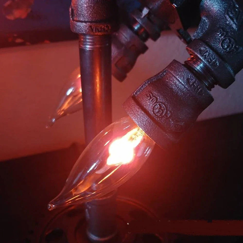 Retro rocket-shaped steampunk lamp with warm, ambient LED lighting for industrial-chic home decor