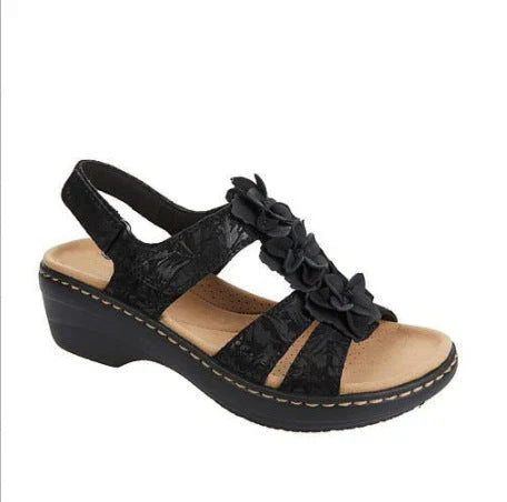 Stylish floral wedge sandals with patent leather upper and adjustable Velcro fastening
