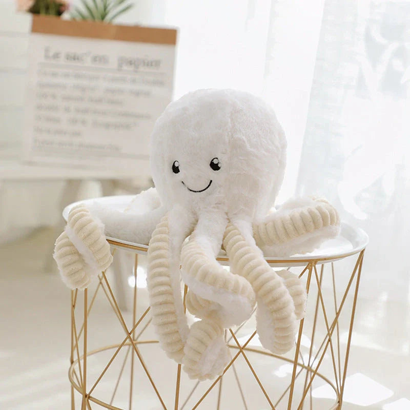 Plush octopus toy with big, bright eyes and a charming, smiling expression