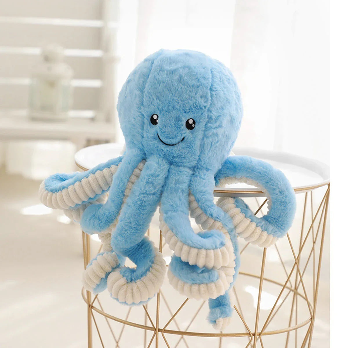 Plush octopus toy with big, bright eyes and a charming, smiling expression