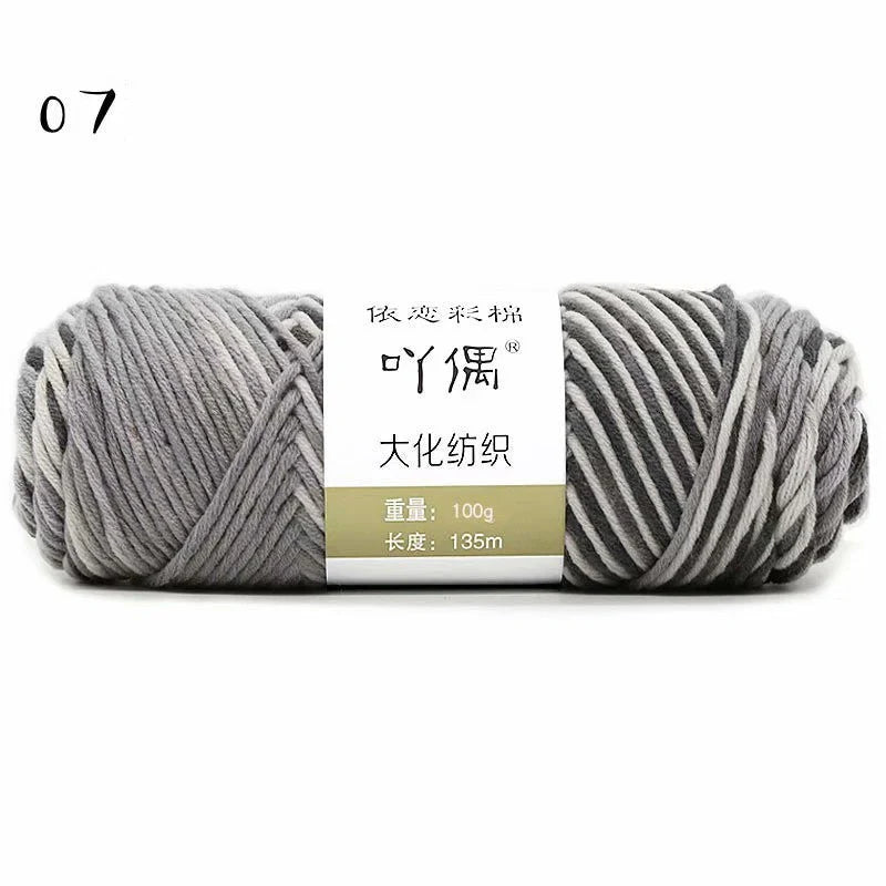Luxurious gradient milk cotton yarn balls in a variety of vibrant colours, perfect for knitting, weaving, and other textile crafts.
