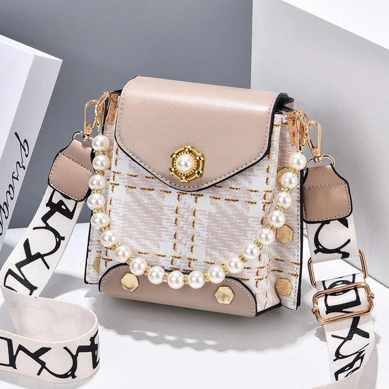 Premium crossbody phone bag with elegant pearl charm, made of durable PU leather and available in multiple color options