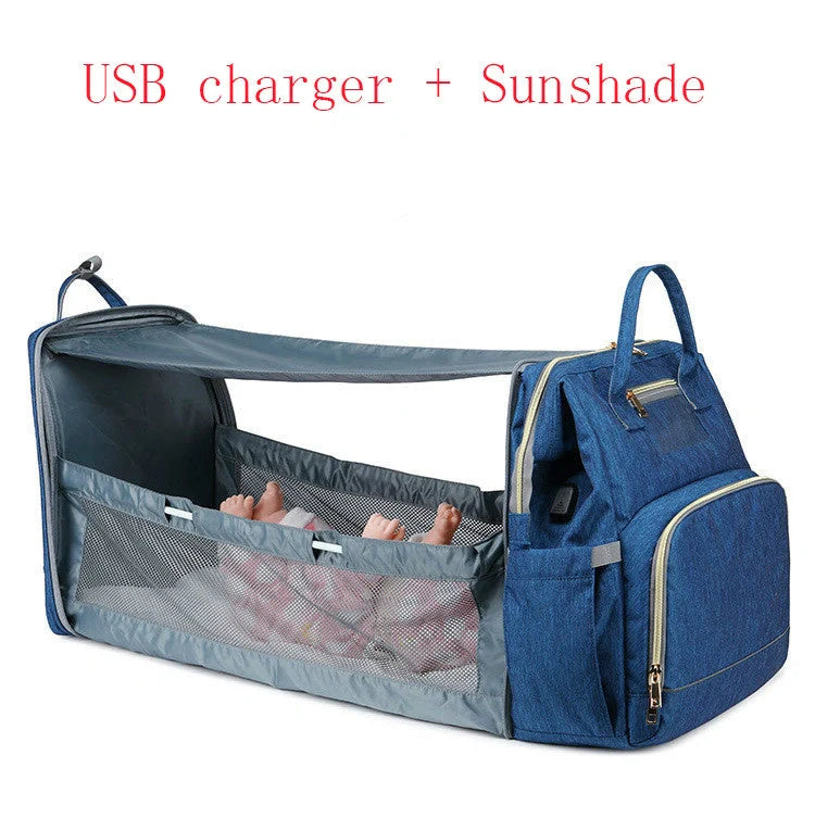 Portable folding crib and mummy bag in green and grey, compact design for baby travel